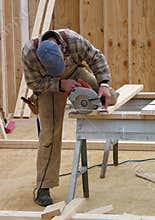 Carpenter using a circular saw