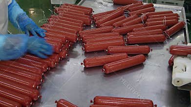 Production of sausages salami in a meat processing factory