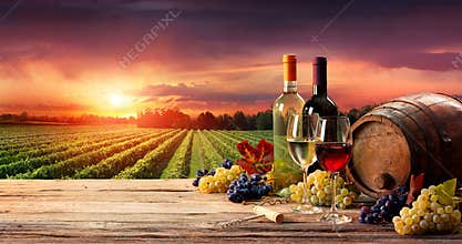 Barrel Wineglasses And Bottle In Vineyard