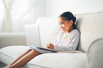 Back to School. asian Little girl using his laptop