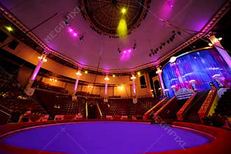 Circle arena in circus purple light lamps