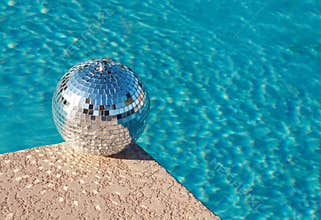 Party! Disco Ball beside resort swimming pool