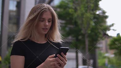 Woman uses her cellular phone