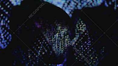 Tender kiss of young couple against night club sparkling background, passion