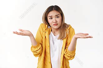 I not know. Frustated gloomy upset confused asian cute blond girl shrugging hands spread sideways dismay full disbelief