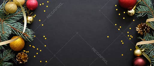 Christmas banner. Black Xmas background with fir tree branches, golden and red balls, confetti. Christmas frame, greeting card