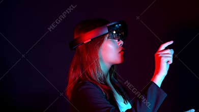Business woman try vr glasses hololens in the dark room | Portrait of young asian girl experience ar communication | Future