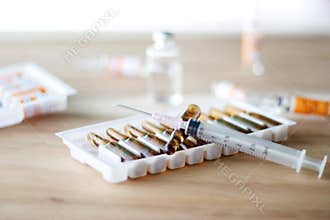 Medicine and syringe on table background, Healthcare and medical