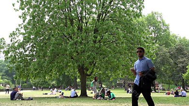 London James`s Park, People Tourists Relaxing Resting on Grass at Picnic