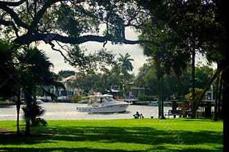 Fort Lauderdale, Florida, U.S.A - January 3, 2020 - A boat passing the waterfront home by Colee Hammock Park