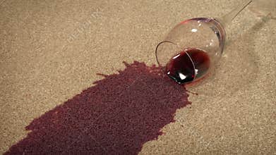 Glass of wine knocked over on carpet