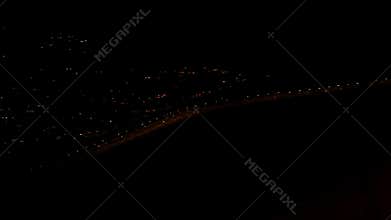 Overhead view of distant red tinted city lights
