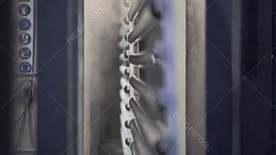 Industrial painting of aluminium profiles from spray guns. Painting parts in workshop of enterprise without human
