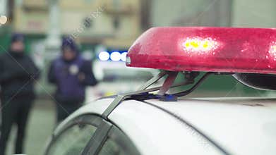 Police officers at the crime scene. Flashing police flasher. Kyiv. Ukraine