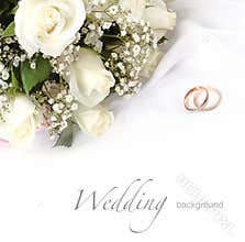 Wedding rings and roses bouquet