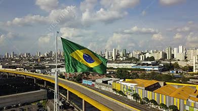 Brazil flag fluttering in strong wind shot with drone