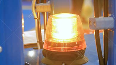 Close up of warning orange beacon flashing