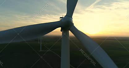Aerial view of wind turbine at sunset