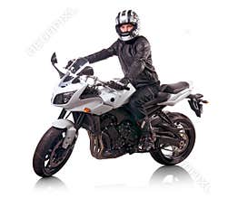Biker rides white motorcycle