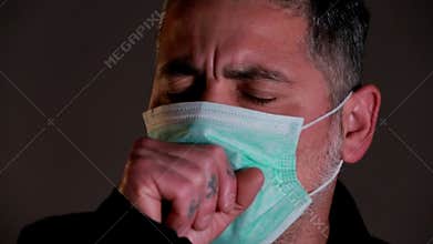 A man in sick protective medical mask coughs. Contagion risk prevention