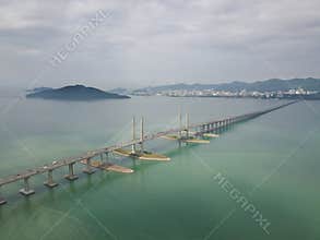 Aerial view Penang Bridge with island at background.