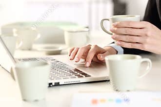 Executive hands overworking taking caffeine drink