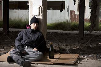 Alcoholic Sitting on the Floor