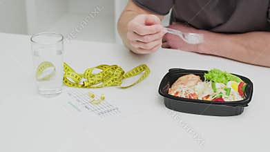 Athletic man eating full of protein foods for sports nutrition before training.