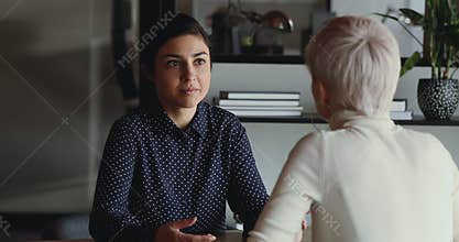 Confident Indian female applicant speaks to hr at job interview
