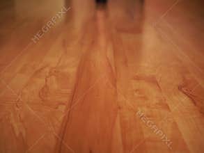 A woman in black shoes throws lace lingerie on the floor and leaves.