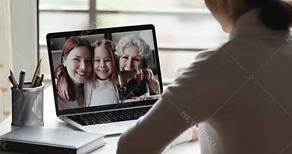 Young woman video calling big family in conference group chat