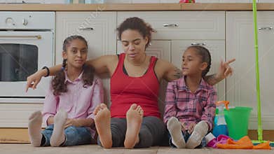 African American family resting after cleanup