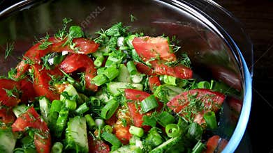 Preparing a salad with fresh vegetables