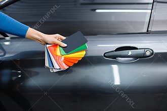 Car wrapping, hand with foil or film color palette