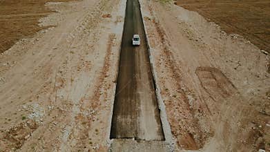 Car is nearing the end of the highway. The end of the road. Apocalypse concept.