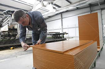 Worker in furniture factory