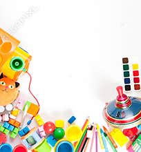 Children's toys scattered on a white sheet