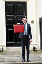 Rishi Sunak, Chancellor of the Exchequer, leaves No.11 Downing Street to present his budget at the H