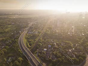 Aerial view of the road to city, sun light