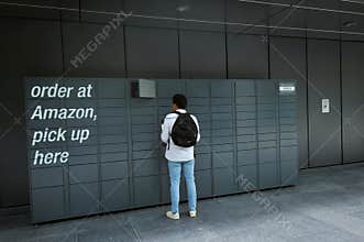 Amazon client at the pickup locker to collect a package in London England United Kingdom