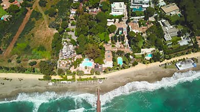 Aerial view of beautiful wood bridge `Puente Romano` - Marbella. Empty beach
