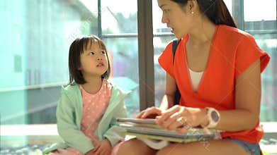 4k real time of asian parent and obeying child reading at the library