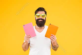 Studying with pleasure. Have fun. Learning with happiness. Funny cheerful adult man in sunglasses hold books. Study in