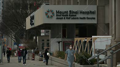 Hospital establishing shot Day. Exterior shot of matching set day night.