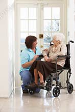 Carer With Disabled Senior Woman