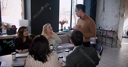 Teamwork at healthy multiethnic workplace. Excited young Asian coach businessman leading team at loft office slow motion