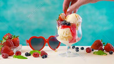 Making gourmet berry and vanilla ice cream sundae time lapse.