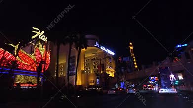 Night Drive on Las Vegas Strip, Nevada USA. Traffic and View of Neon Lights
