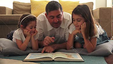 Father tutoring his daughters at home
