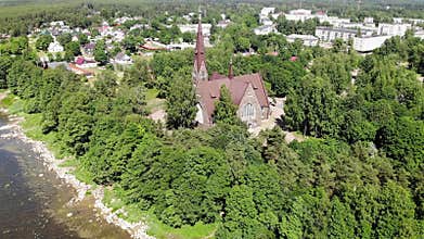 Old nice catholic church. on the shore of lake or sea. Primorsk Koivisto, aerial